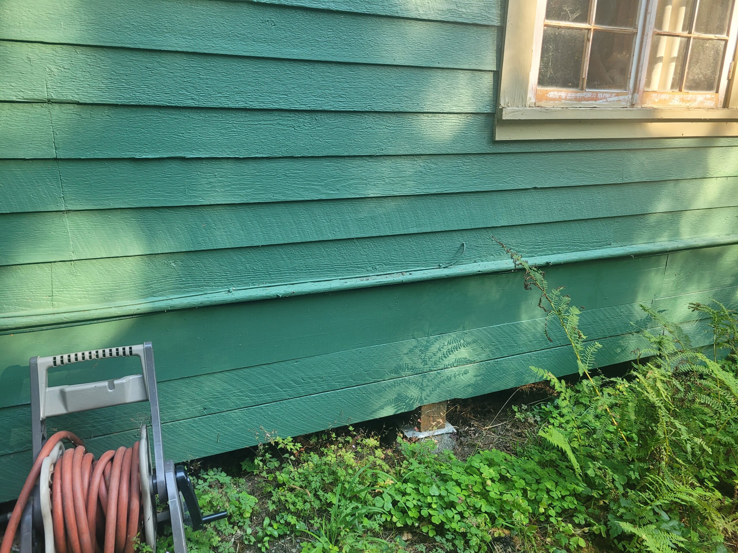 Exterior wall of a Portland-area home before a ductless heat pump was installed