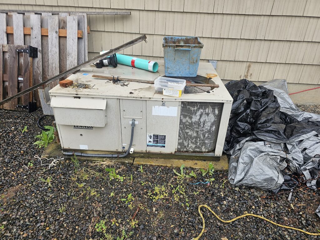 Aging Lennox packaged HVAC unit at a Gresham home, assessed for repair or replacement
