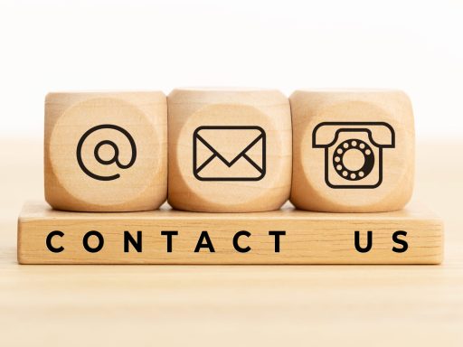 Contact us concept. Wooden blocks with email, mail and telephone icons.Website page contact us or e-mail marketing